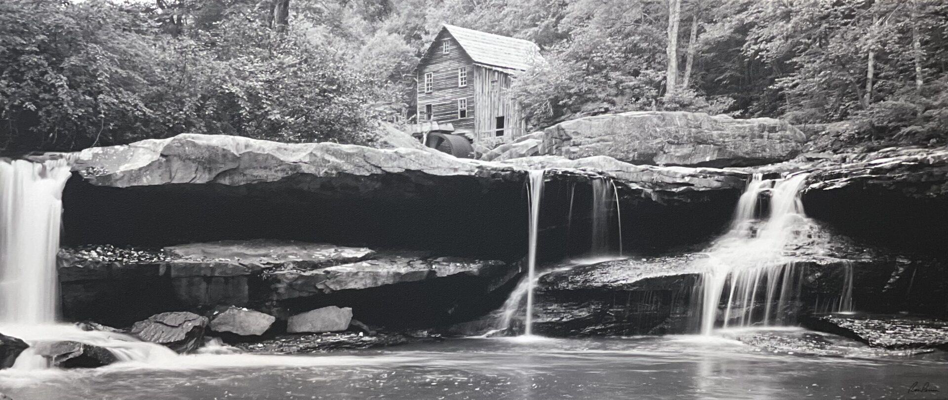 A black and white photograph of a waterfall.