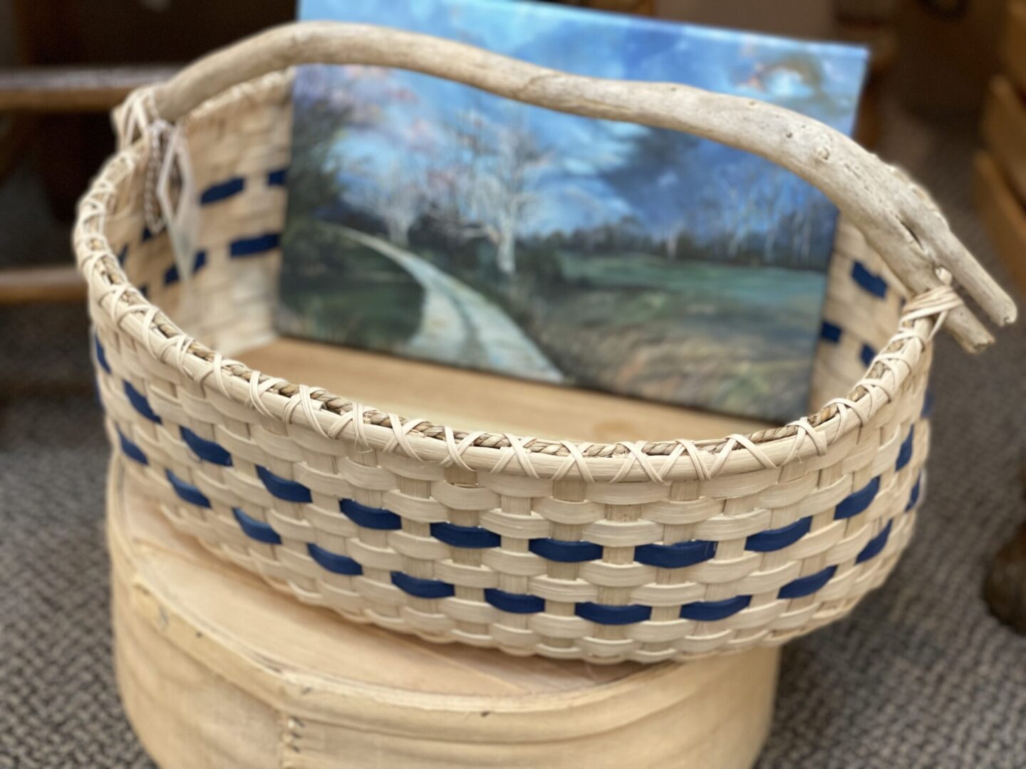 A blue and white basket with a picture on it.