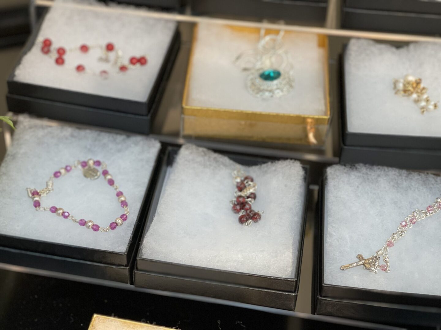 A display of bracelets and necklaces on a table.