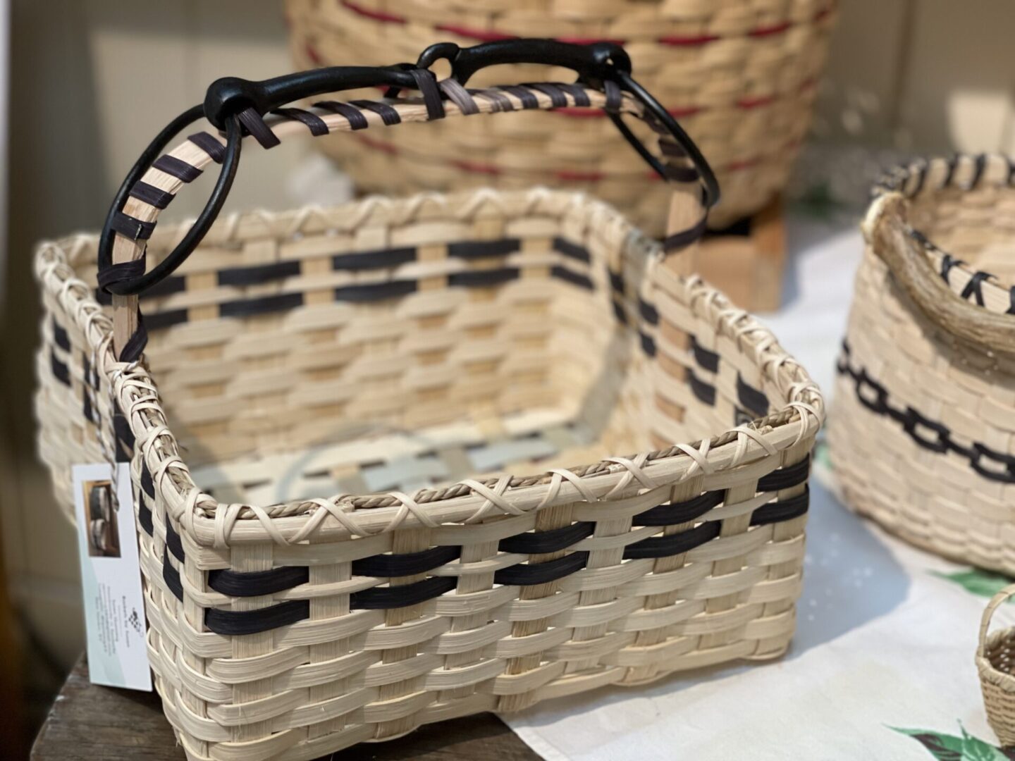 Two baskets on a table next to each other.