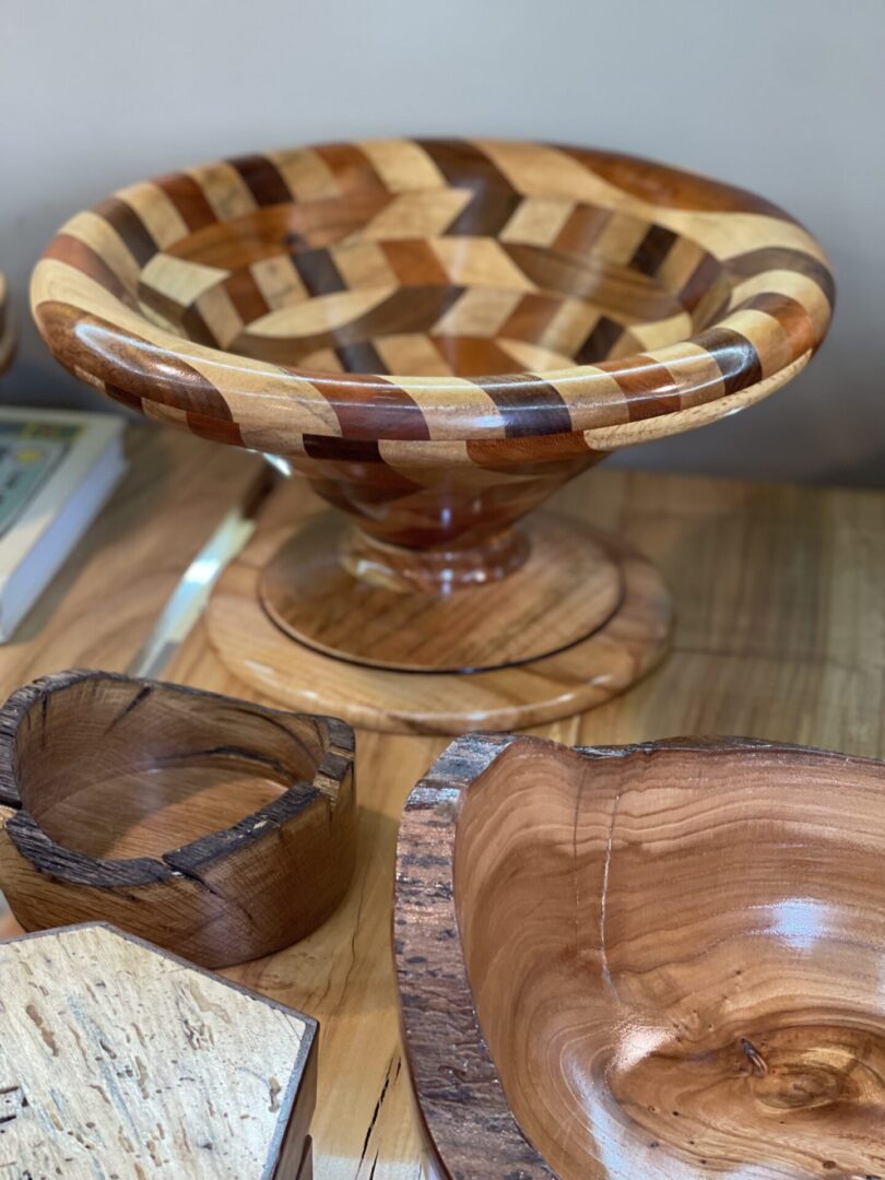 Wood bowls and bowls on a table.