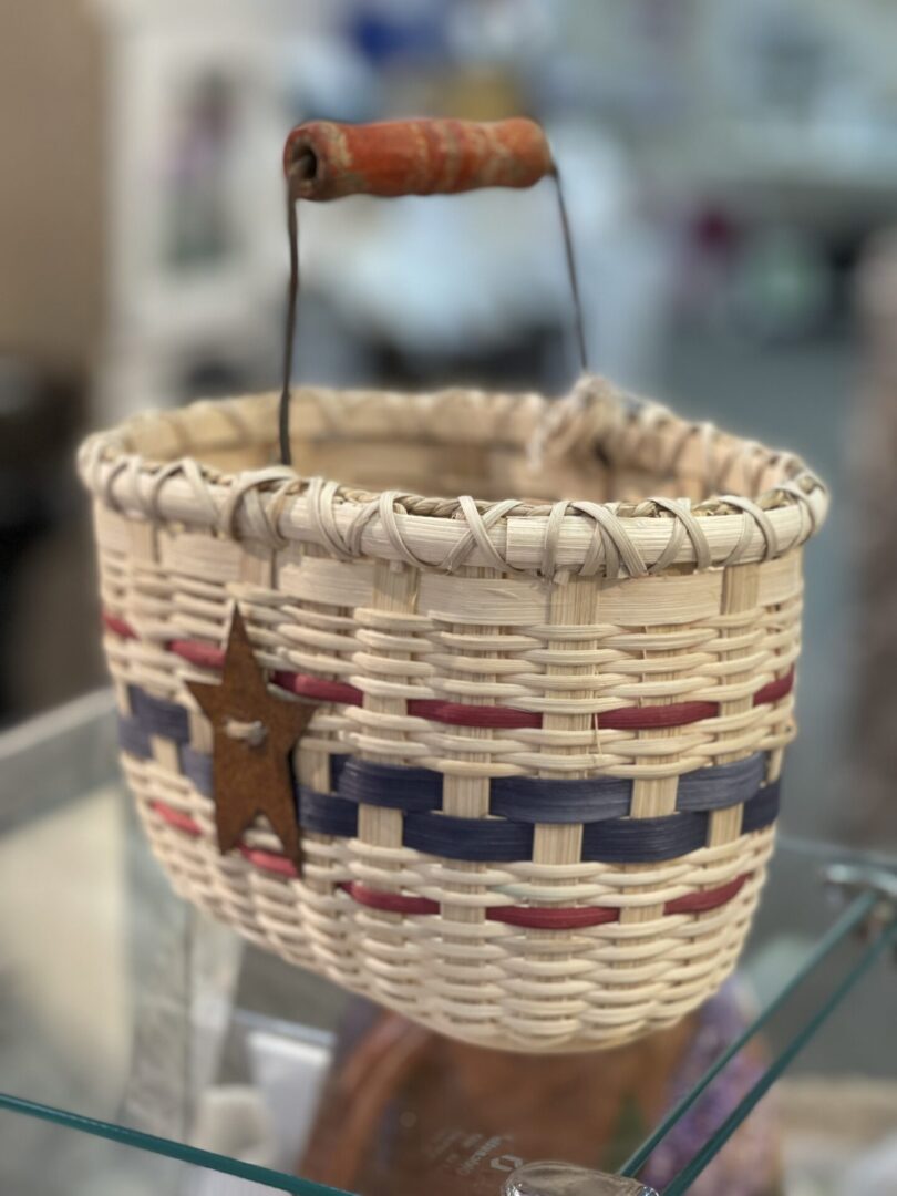 A small wicker basket with a star on it.