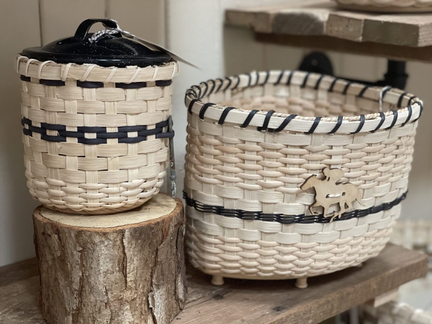 Two baskets sitting on top of a wooden shelf.