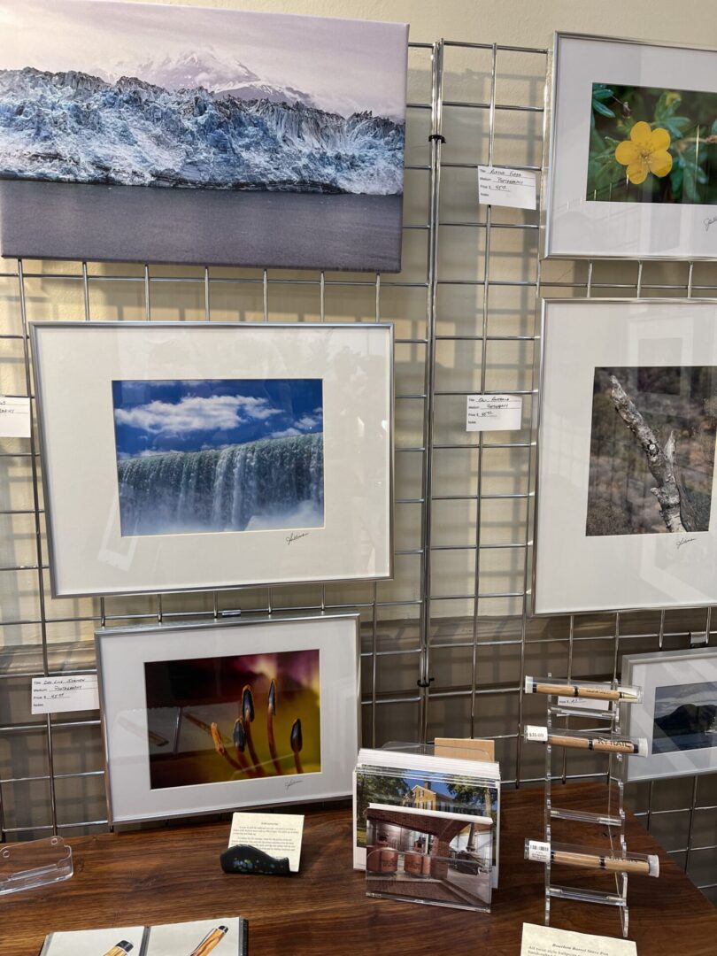 A display of framed pictures on a table.