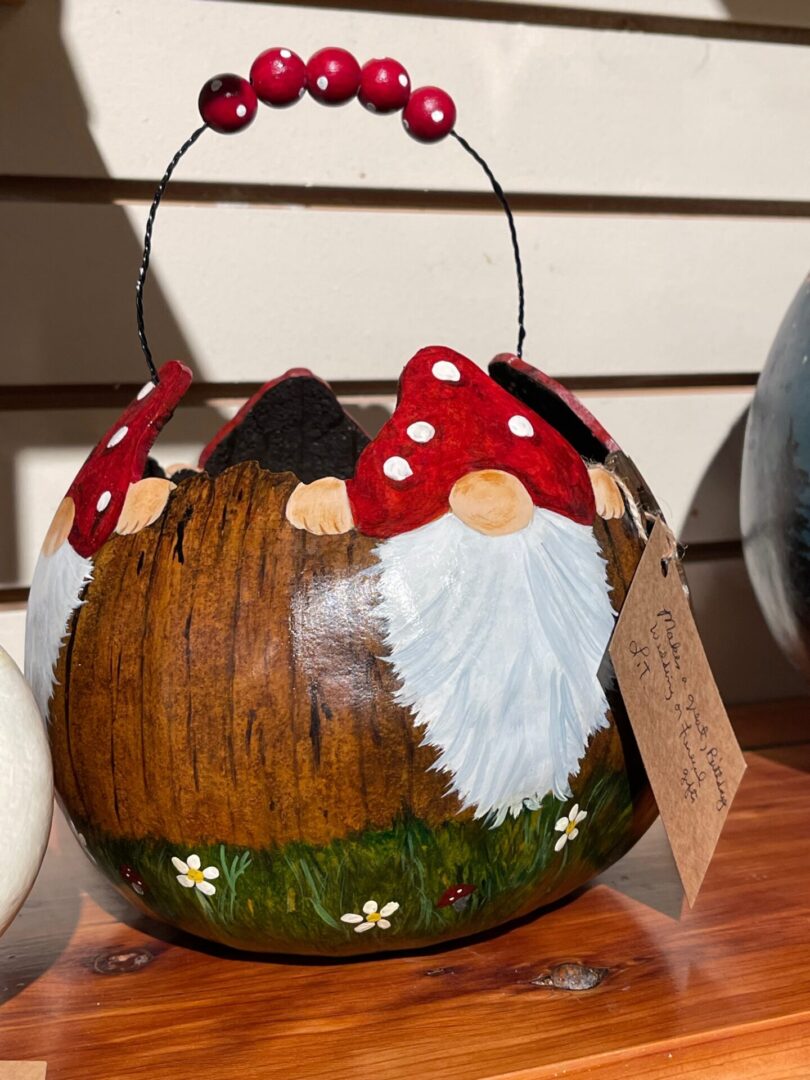 A wooden basket with gnomes on it.