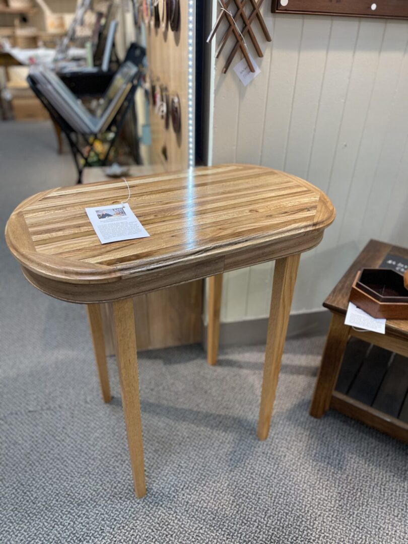 A table with a wooden top and a wooden base.