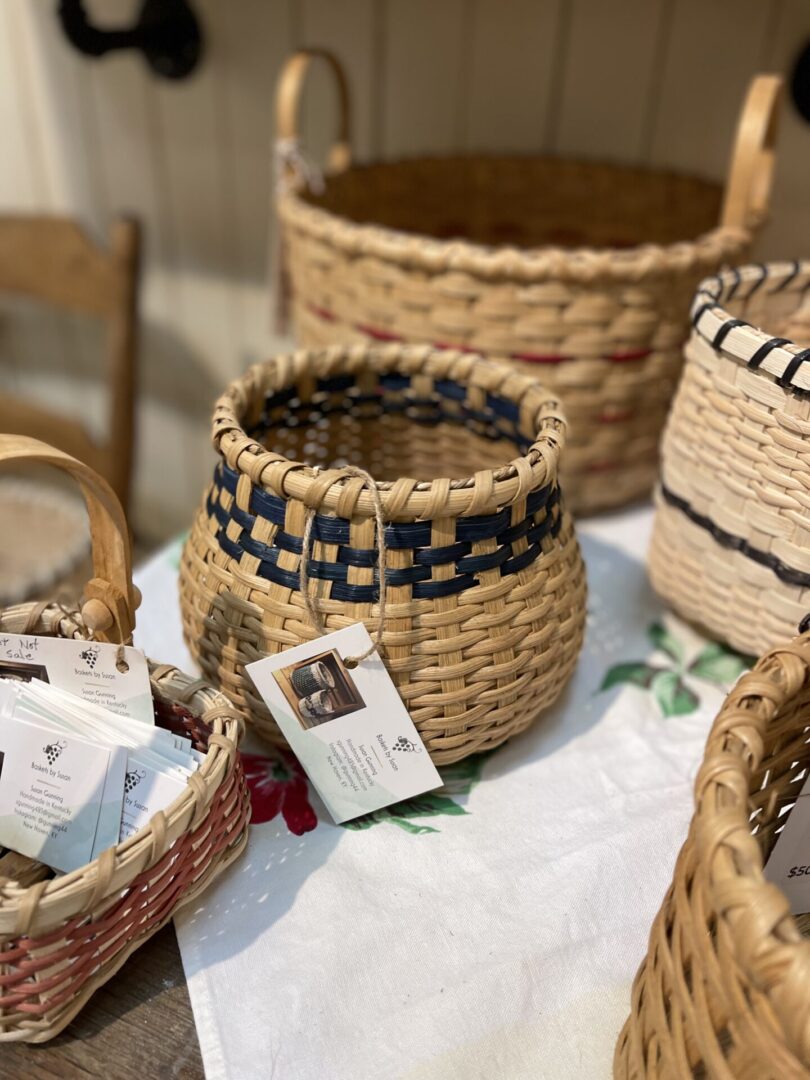 Baskets on a table with tags on them.
