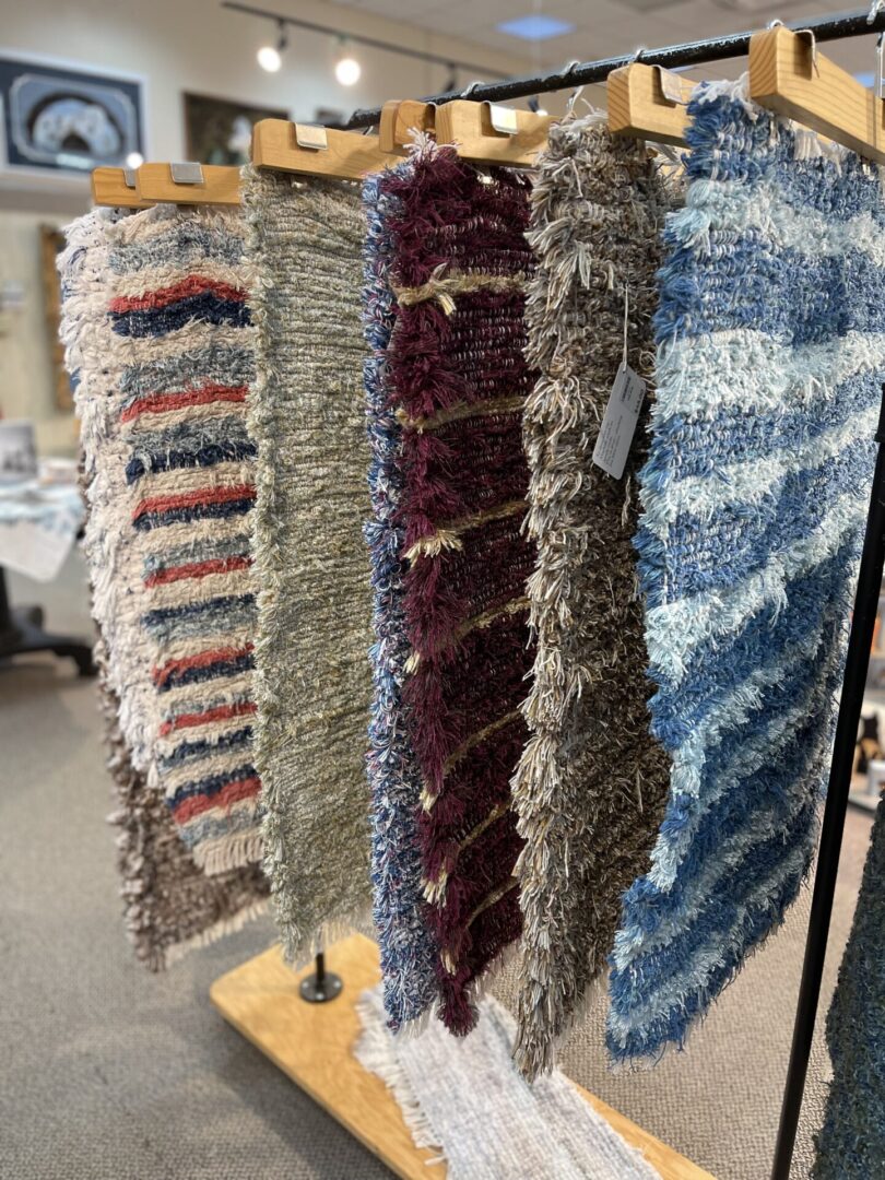 A selection of rugs on display in a store.