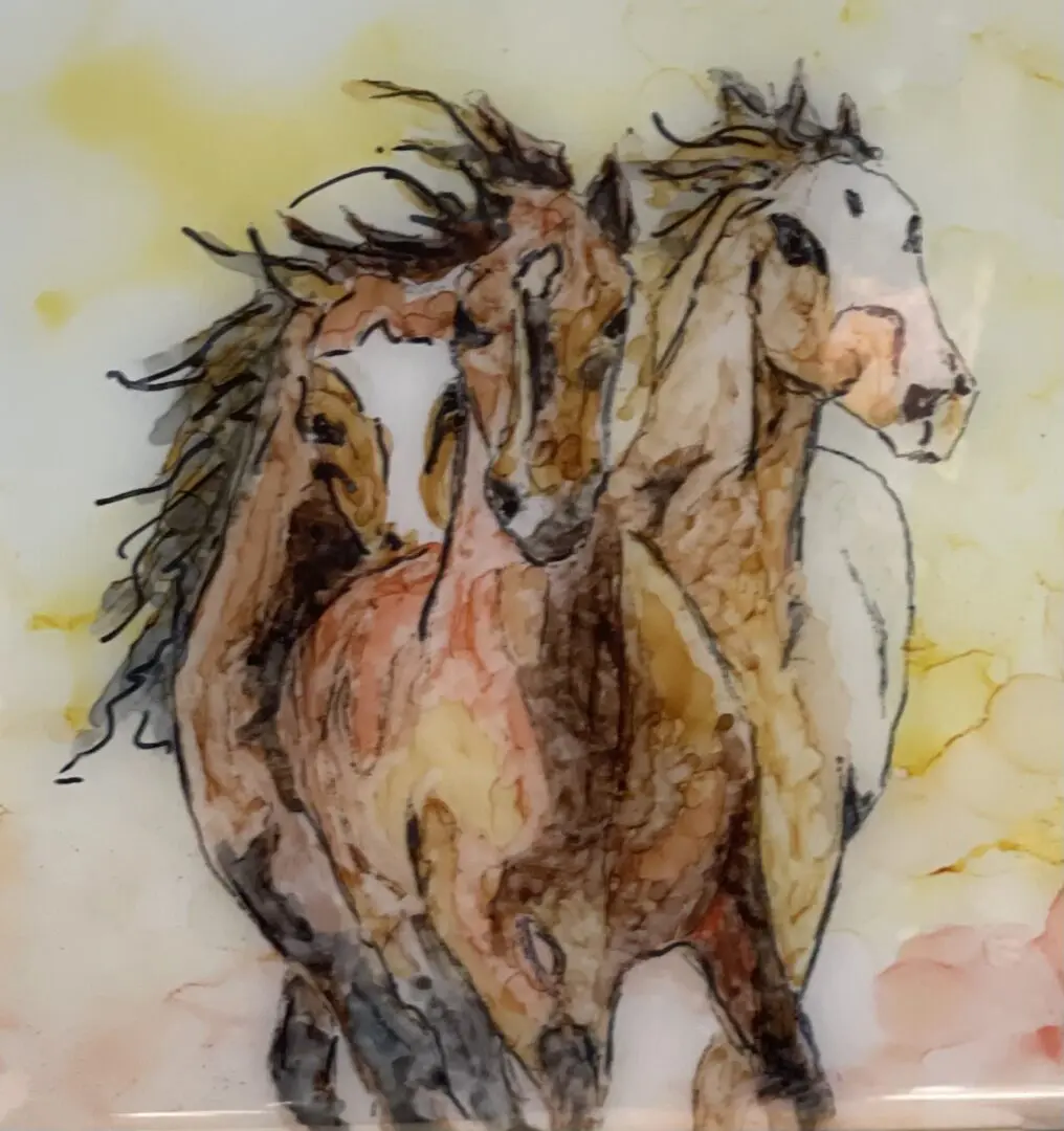 Three horses running on a glass plate.