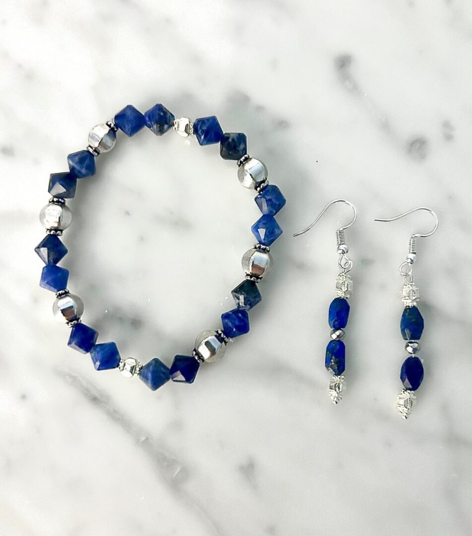 Blue gemstone bracelet and earrings set.