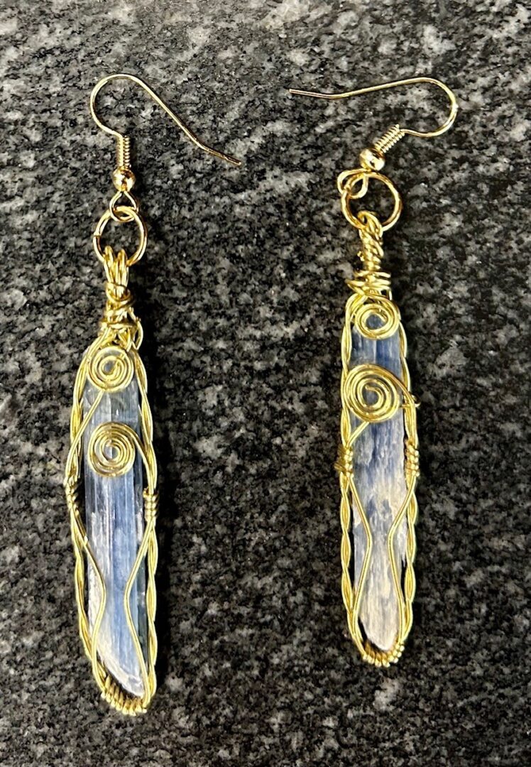 Gold wire wrapped blue kyanite earrings.