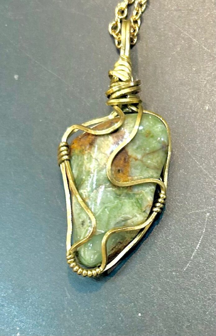 Green stone wire wrapped pendant necklace.